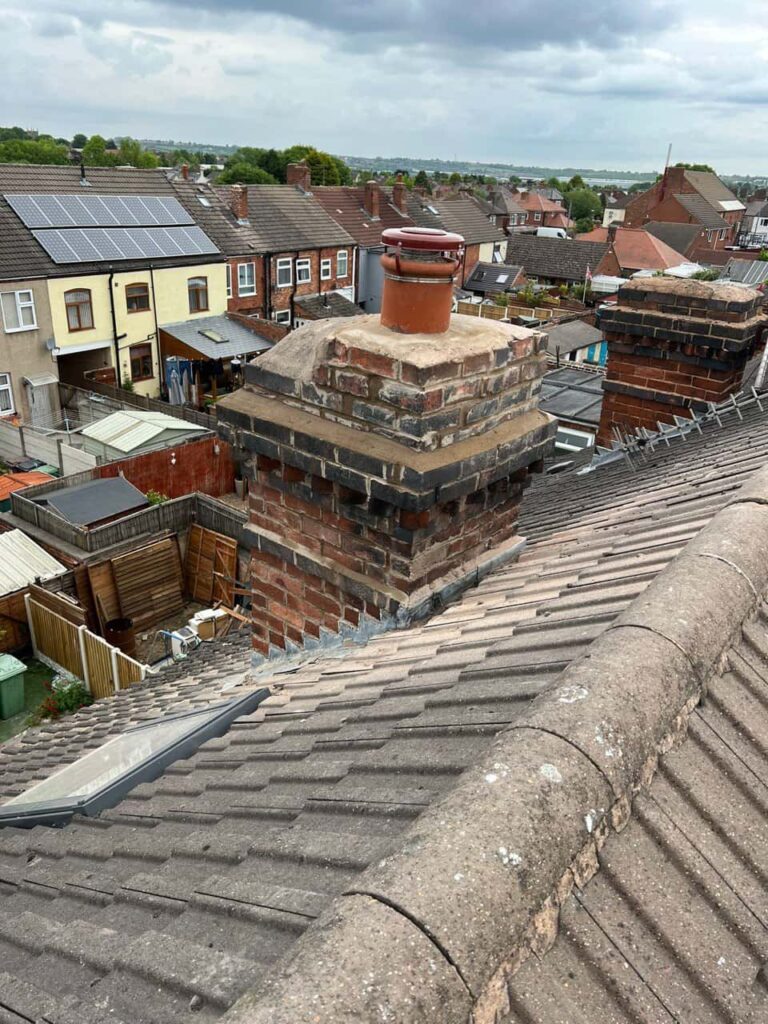 This is a photo taken from a roof which is being repaired by Horley Roofing Repairs, it shows a street of houses, and their roofs