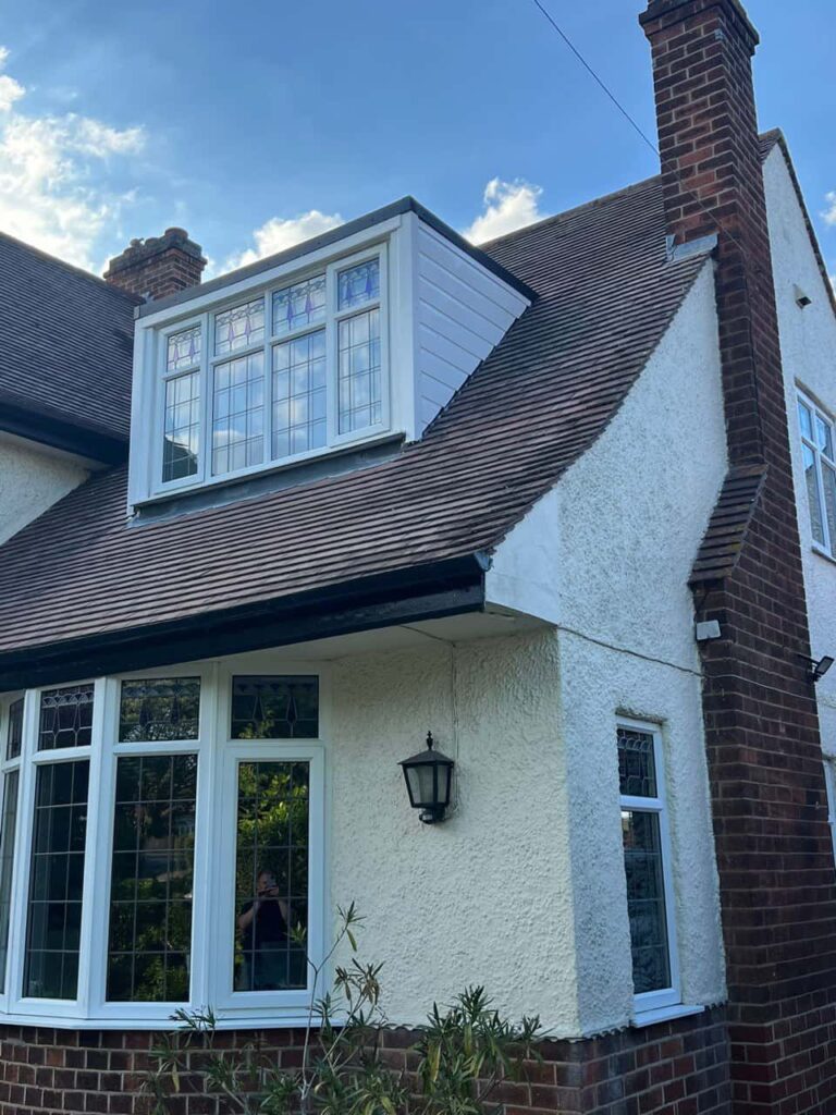 This is a photo of a dormer window which has just had some repairs carried out where the roof and the dormer meet. Works carried out by Horley Roofing Repairs